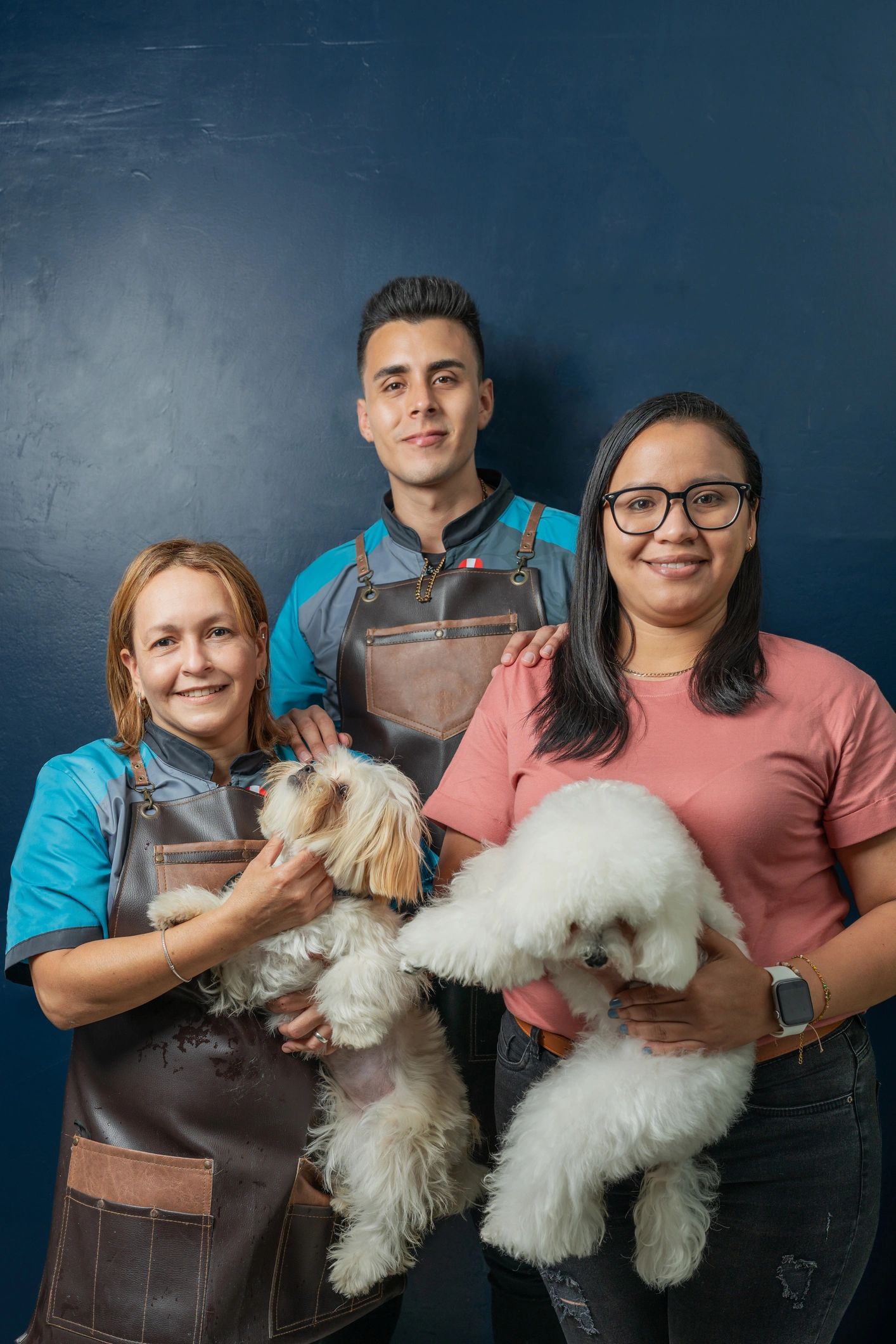 Pet care team portrait with dogs